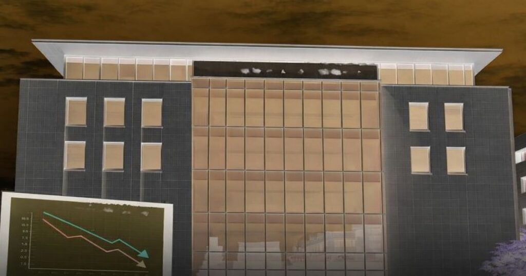 業績悪化を示す下落グラフと倒産した企業のオフィスビル外観